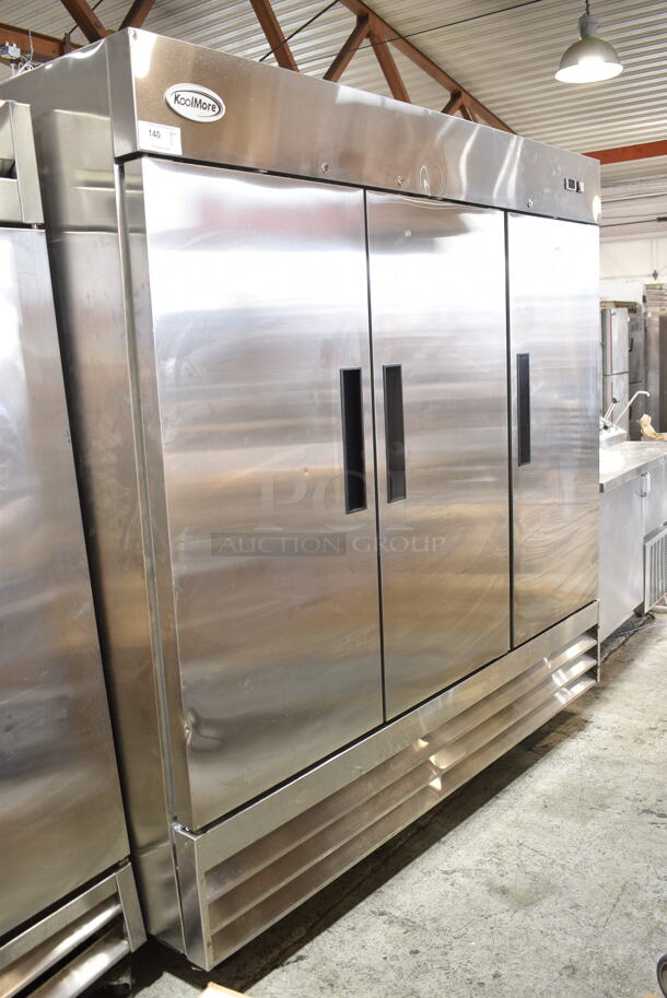 KoolMore RIF-3D-SS Stainless Steel Commercial 3 Door Reach In Freezer w/ Poly Coated Racks on Commercial Casters. 115 Volts, 1 Phase. Tested and Powers On But Does Not Get Cold