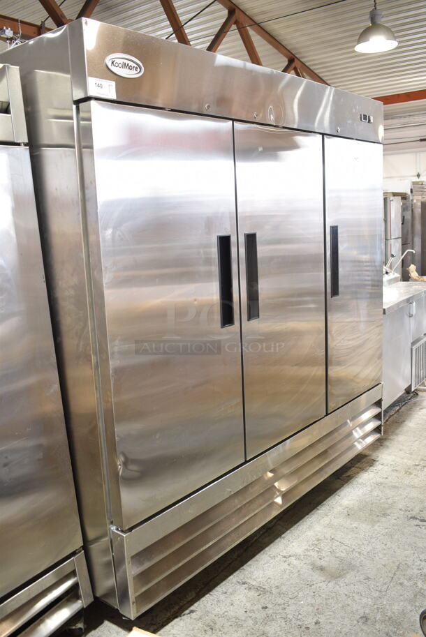 KoolMore RIF-3D-SS Stainless Steel Commercial 3 Door Reach In Freezer w/ Poly Coated Racks on Commercial Casters. 115 Volts, 1 Phase. Tested and Powers On But Does Not Get Cold - Item #1127170