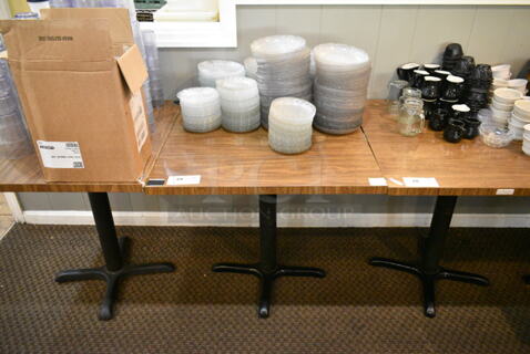 Wood Pattern Dining Height Table w/ Contents Including Clear Salad Plates. (main dining room)