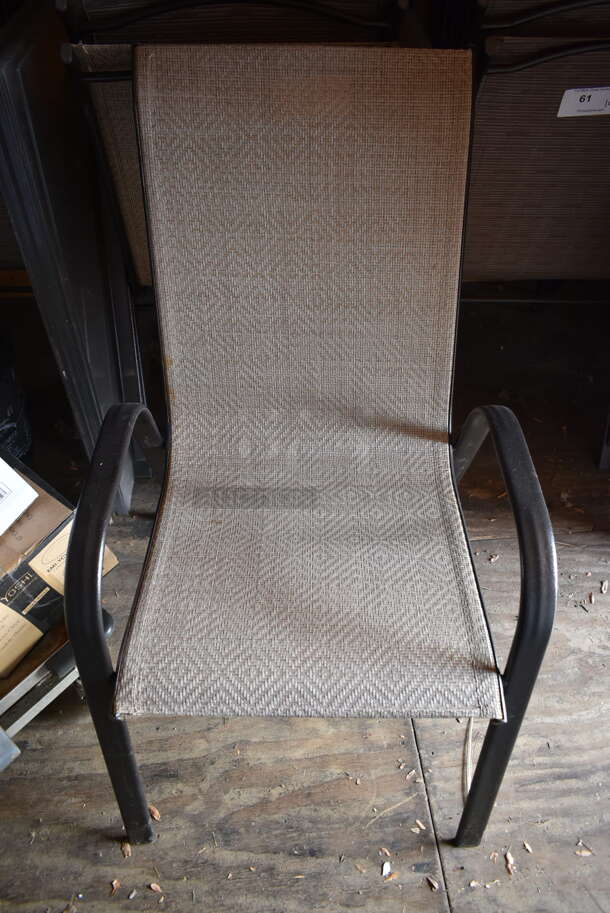 16 Light Brown / Tan Patio Chairs on Black Metal Frame. Stock Picture - Cosmetic Condition May Vary. 16 Times Your Bid! (outside shed)