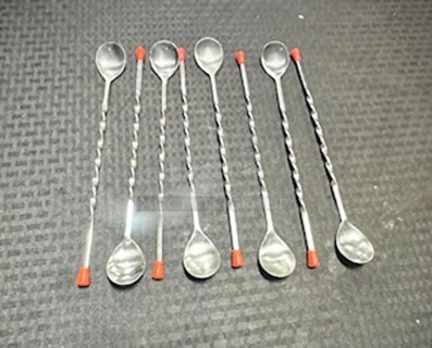 One Lot Of 8 Swizel Spoons.