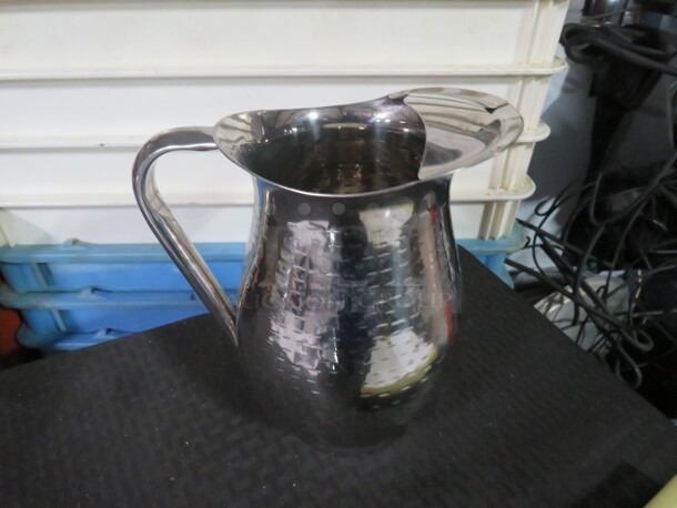 One Stainless Steel Pitcher.