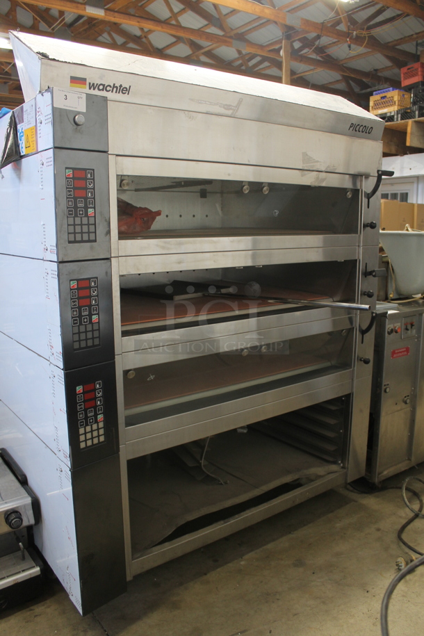 BRAND NEW SCRATCH AND DENT! 2012 Wachtel Piccolo II-3 Basic Stainless Steel Commercial Electric Powered 3 Deck Bakery Oven Pizza Oven w/ Cooking Stones and Lower Pan Rack on Commercial Casters. 220 Volts, 3 Phase. 