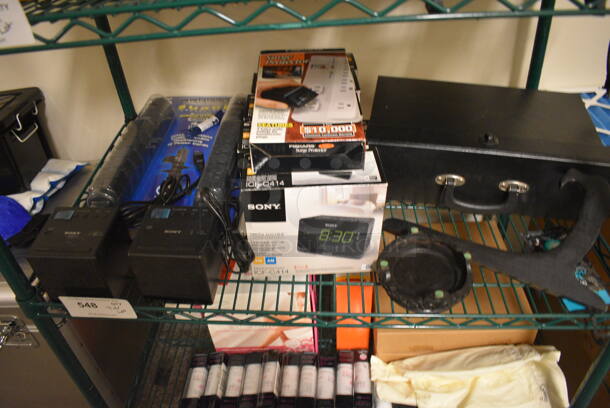 ALL ONE MONEY! Tier Lot of Various Items Including Sony Alarm Clock, Surge Protectors, and Black Case
