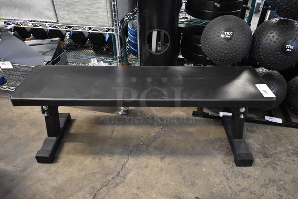 Rogue Metal Black Flat Workout Bench. Stock Picture - Cosmetic Condition May Vary.