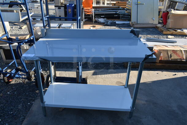 BRAND NEW SCRATCH AND DENT! Stainless Steel Commercial Table w/ Under Shelf and Back Splash.