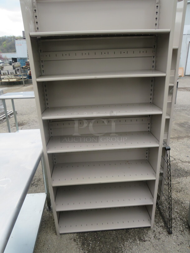 One Metal Shelving System With 7 Shelves. 36X12X26