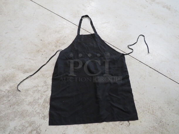 One Lot Of 10 Black Aprons.