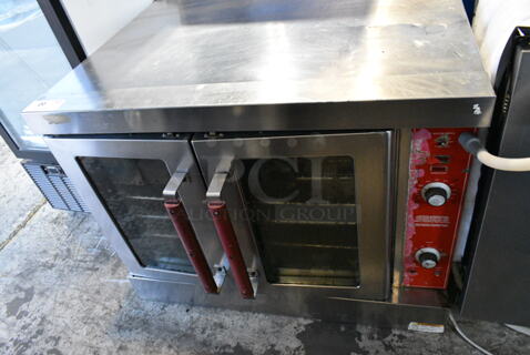 Vulcan VC4GD-10 Stainless Steel Commercial Natural Gas Powered Full Size Convection Oven w/ View Through Doors, Metal Oven Racks, Metal Legs and Thermostatic Controls. 