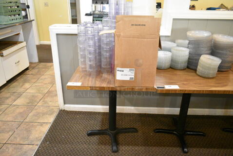 Wood Pattern Dining Height Table w/ Contents Including Poly Beverage Tumblers. (main dining room)