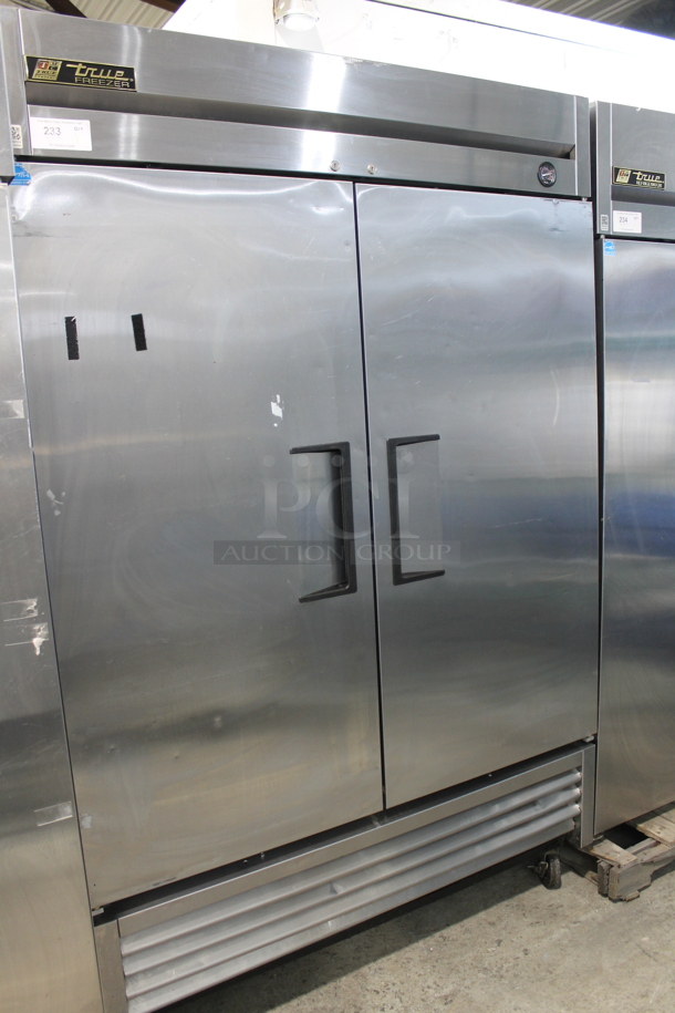 True T-49F Stainless Steel Commercial 2 Door Reach In Freezer w/ Poly Coated Racks on Commercial Casters. 115 Volts, 1 Phase. Tested and Working!
