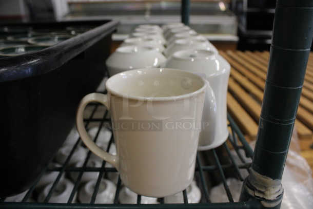 12 White Ceramic Mugs. Includes 4.5x3x4. 12 Times Your Bid!