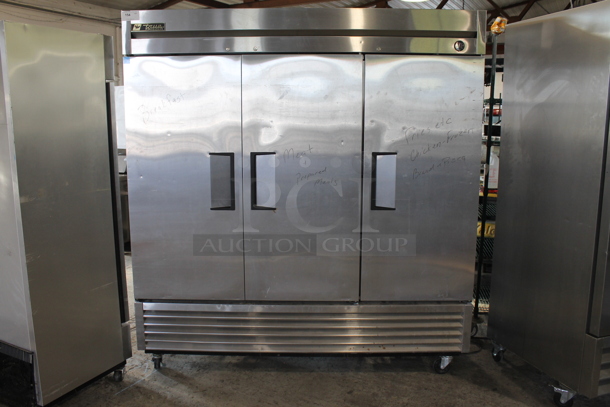 2012 True T-72F ENERGY STAR Stainless Steel Commercial 3 Door Reach In Freezer w/ Poly Coated Racks on Commercial Casters. 115 Volts, 1 Phase. Tested and Working!