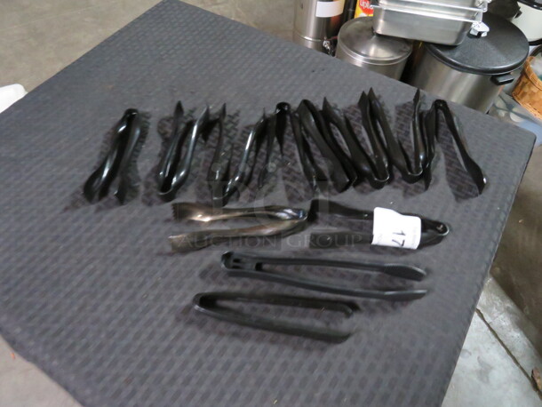 One Lot Of 12 Assorted Tongs.