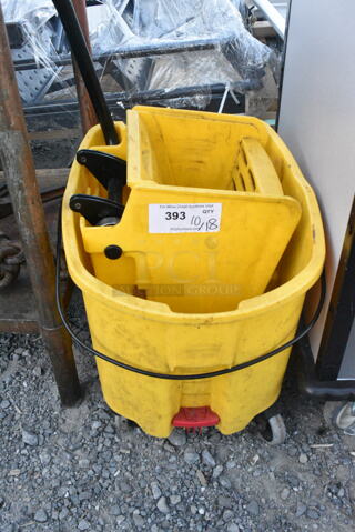 Yellow Poly Mop Bucket w/ Wringing Attachment on Casters. 