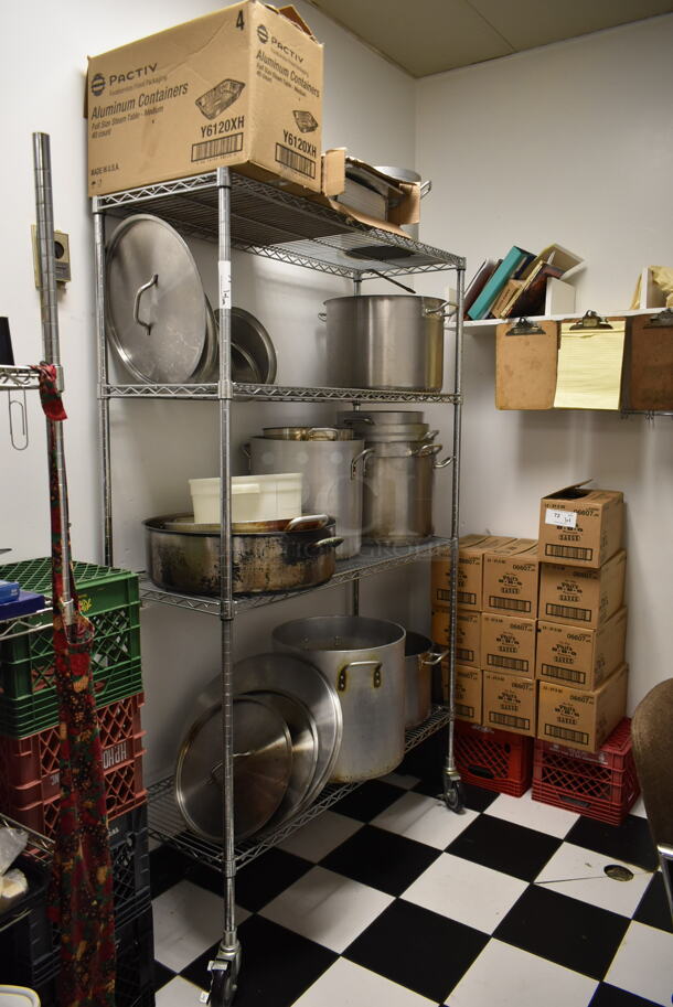 Metro Chrome Finish 4 Tier Wire Shelving Unit w/ Contents Including Metal Stock Pots on Commercial Casters. BUYER MUST REMOVE: BUYER MUST DISMANTLE. PCI CANNOT DISMANTLE FOR SHIPPING. PLEASE CONSIDER FREIGHT CHARGES. (kitchen)