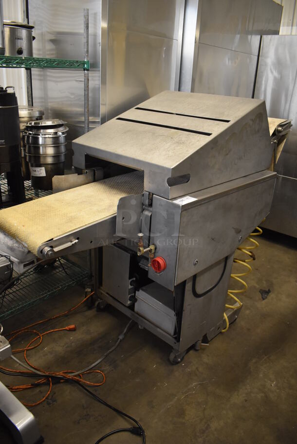 Townsend 9000 Stainless Steel Commercial Floor Style Automatic Membrane Skinner on Commercial Casters. 125-250 Volts, 1 Phase. 80x29x54