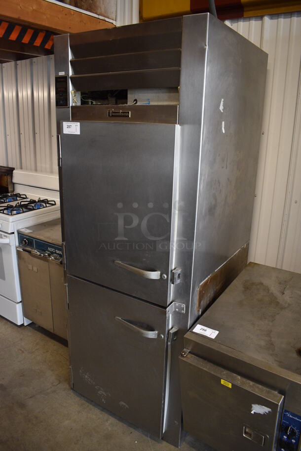 Traulsen Model RHT 1-32WUT Stainless Steel Commercial 2 Half Size Door Reach In Cooler w/ Metal Racks. 115 Volts, 1 Phase. 30x34x78. Cannot Test - Unit Was Previously Hardwired