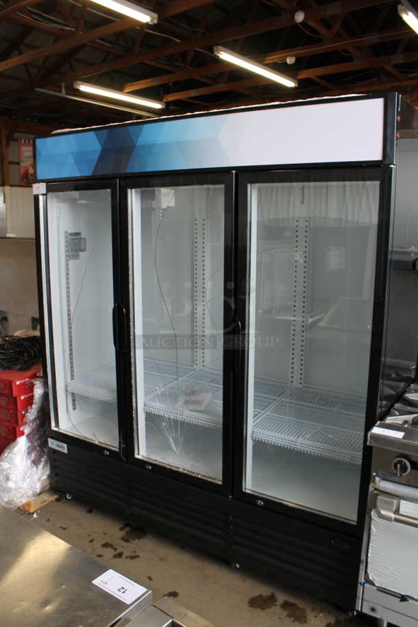 BRAND NEW SCRATCH AND DENT! 2023 KoolMore MDR-3GD-63C Metal Commercial 3 Door Reach In Cooler Merchandiser w/ Poly Coated Racks. See Pictures For Broken Glass and Damage to Corner of Door. 110-120 Volts, 1 Phase. Tested and Working!