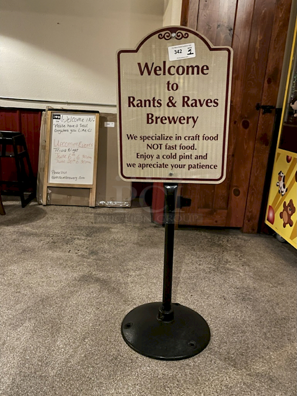 Weighted Metal Sign Holder With Reflective Aluminum "Rants & Raves Brewery" Sign Attached.