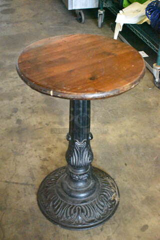 2 Round Tables on Ornate Black Metal Table Base. 24x24x30, 18x18x29. 2 Times Your Bid! 