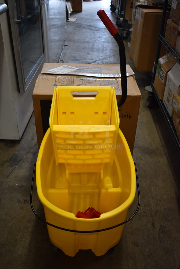 2 BRAND NEW IN BOX! Rubbermaid Yellow Poly Mop Bucket w/ Wringing Attachment on Commercial Casters. 16x24x36. 2 Times Your Bid!