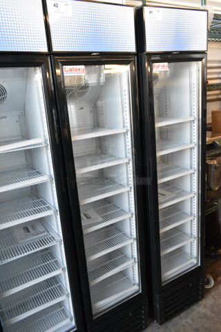 BRAND NEW SCRATCH AND DENT! Galaxy 177GDN5RBB Metal Commercial Single Door Reach In Cooler Merchandiser w/ Poly Coated Racks and Red, White, and Blue LED Lighting. 110-120 Volts, 1 Phase. 