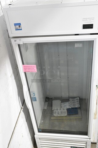 2021 True TSCI-600R-G-PH Metal Commercial Single Door Reach In Cooler Merchandiser. 115 Volts, 1 Phase. 