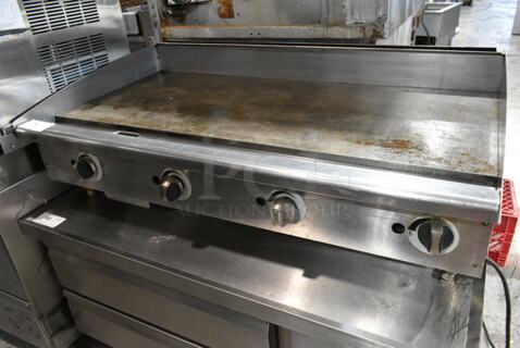 TGM48 Stainless Steel Commercial Countertop Gas Powered Flat Top Griddle. 20,000 BTU. 