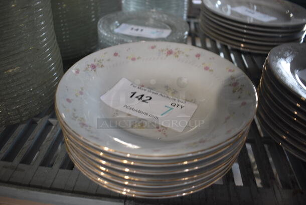 7 White Ceramic Plates w/ Floral Design. 8x8x1.5. 7 Times Your Bid!