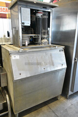 Manitowoc RF1200W Stainless Steel Commercial Ice Machine Head on Commercial Ice Bin. 220 Volts, 1 Phase. 