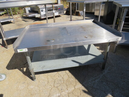 One Stainless Steel Equipment Table With Under Shelf. 48X30.5X26