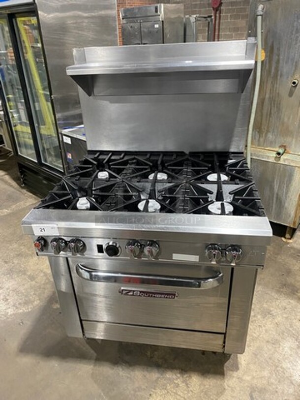 Southbend Commercial Natural Gas Powered 6 Burner Stove! With Raised Back Splash And Salamander Shelf! With Oven Underneath! All Stainless Steel! On Legs! Model: 4361D SN: 16F42941