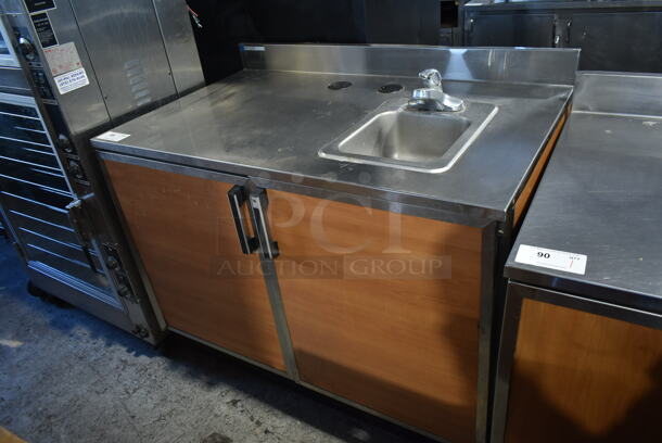 Duke Stainless Steel Commercial Counter w/ Back Splash, 2 Wood Pattern Doors and Sink Bay.