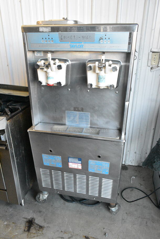 Taylor 755-27 Stainless Steel Commercial 2 Flavor w/ Twist Soft Serve Ice Cream Machine on Commercial Casters. 208-230 Volts, 1 Phase. - Item #1146702