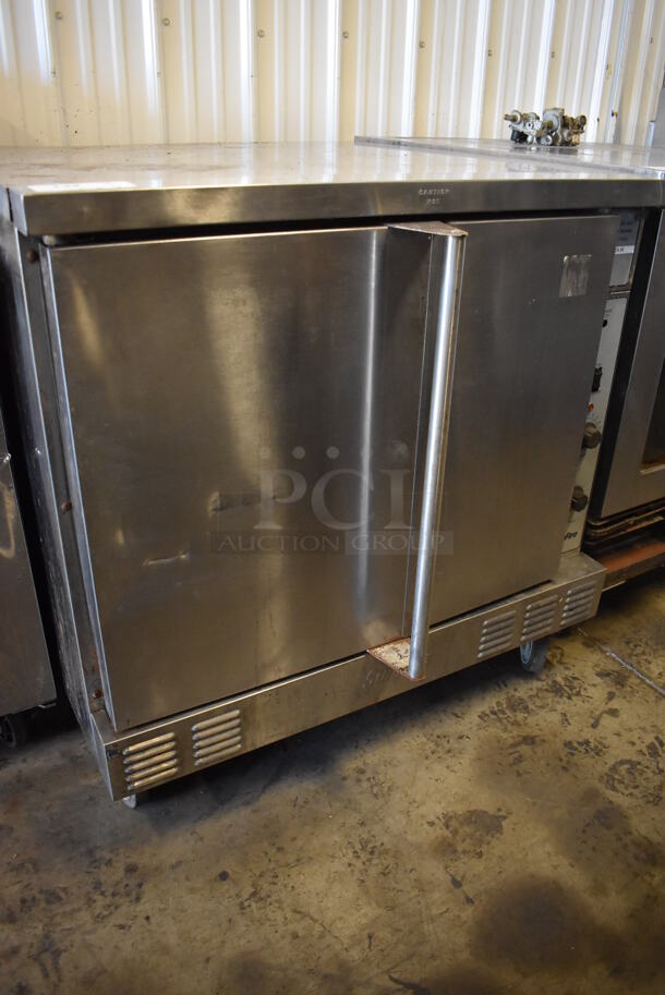 Garland SunFire Stainless Steel Commercial Natural Gas Powered Full Size Convection Oven w/ Solid Doors and Thermostatic Controls on Commercial Casters. 38x42x38