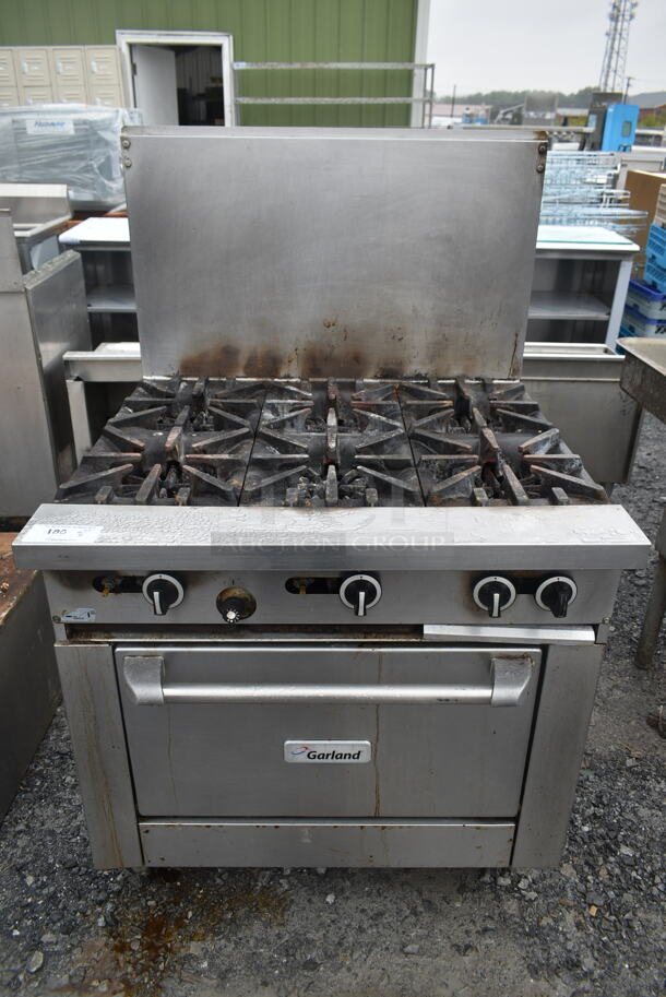 Garland G36-6R Stainless Steel Commercial Natural Gas Powered 6 Burner Range w/ Oven and Back Splash.