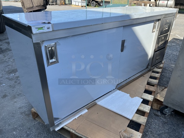 BRAND NEW SCRATCH AND DENT! Regency 600EBT2472R Stainless Steel Commercial 24" x 72" 16 Gauge Type 304 Enclosed Base Sliding Door Table with Drawers