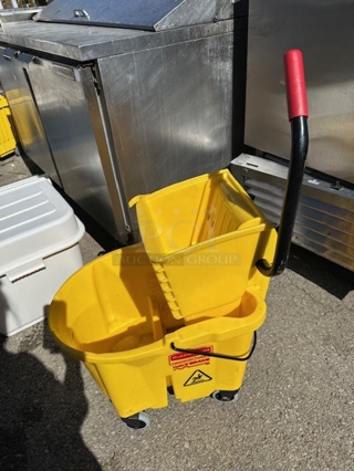 One Rubbermaid Mop Bucket And Wringer.