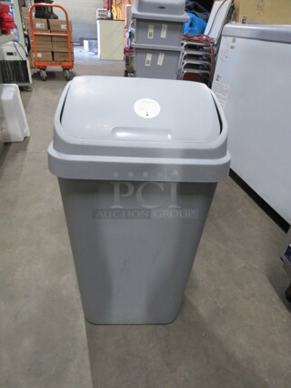 One 10 Gallon Trash Can With Swing Top Lid.