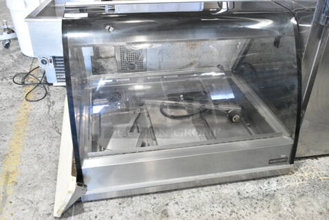 Henny Penny HMR-103 Stainless Steel Commercial Countertop Heated Merchandiser Display Case. 120/208 Volts, 1 Phase. 