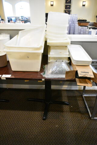 Wood Pattern Dining Height Table w/ Contents Including Poly Bins, Poly Trays. (main dining room)