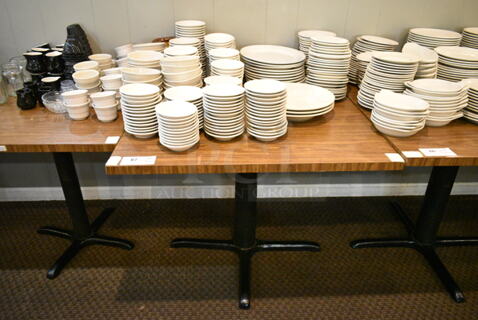 Wood Pattern Dining Height Table w/ Contents Including Ceramic Dishes. (main dining room)