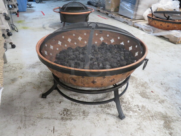 One 35X24 Decorative Metal Firepit With Top Cover.