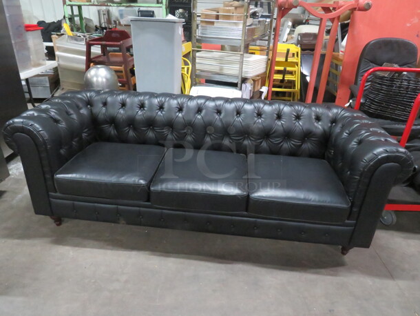 One Black Pleather Couch. 88X35X30