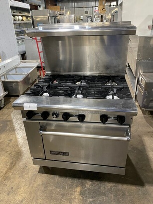 American Range Natural Gas Powered 6 Burner Stove! With Full Size Oven Underneath! With Raised Back Splash And Salamander Shelf! All Stainless Steel! On Casters!