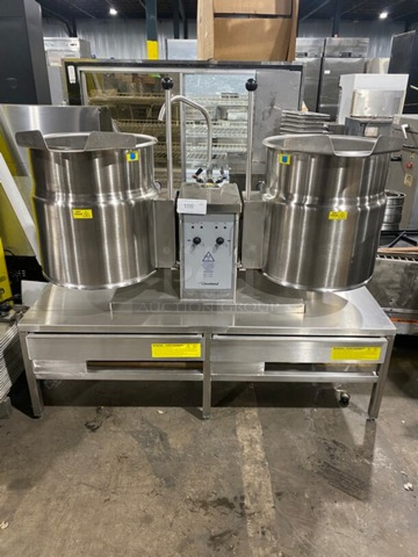 LIKE NEW! Cleveland Commercial Electric Powered Jacketed Tilting Soup Kettle! On Equipment Stand! All Stainless Steel! On Legs! WORKING WHEN REMOVED! Model: TKET12T SN: 111123050377A, 111123050377B! 240V 60HZ 3 Phase!
