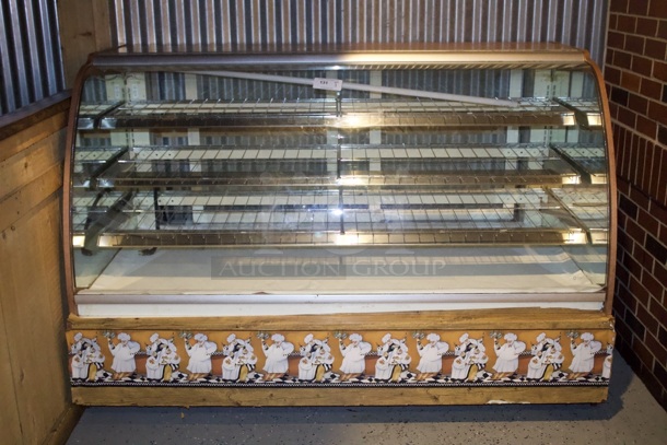 76 Inch Rounded Glass Dry Bakery Display Case, With Lighting. Tested. In Working Order. On Casters. 