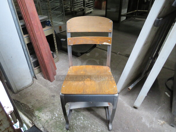 One Wooden Metal Vintage Look Chair.