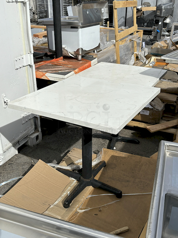 TWO 48" x 34" Marble Top Tables With Stands. 
